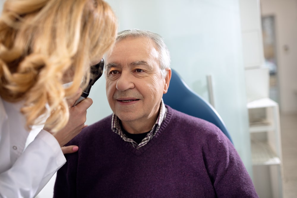 A senior man getting an eye exam with our VSP eye doctor near Nashville, Tennessee