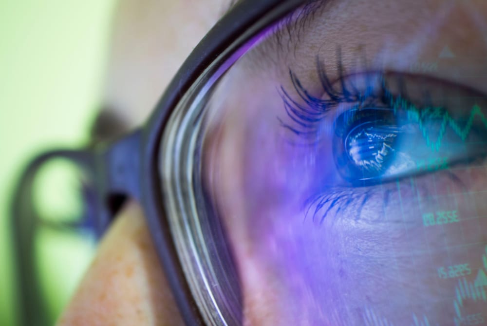 Woman at work using Blue Light Glasses