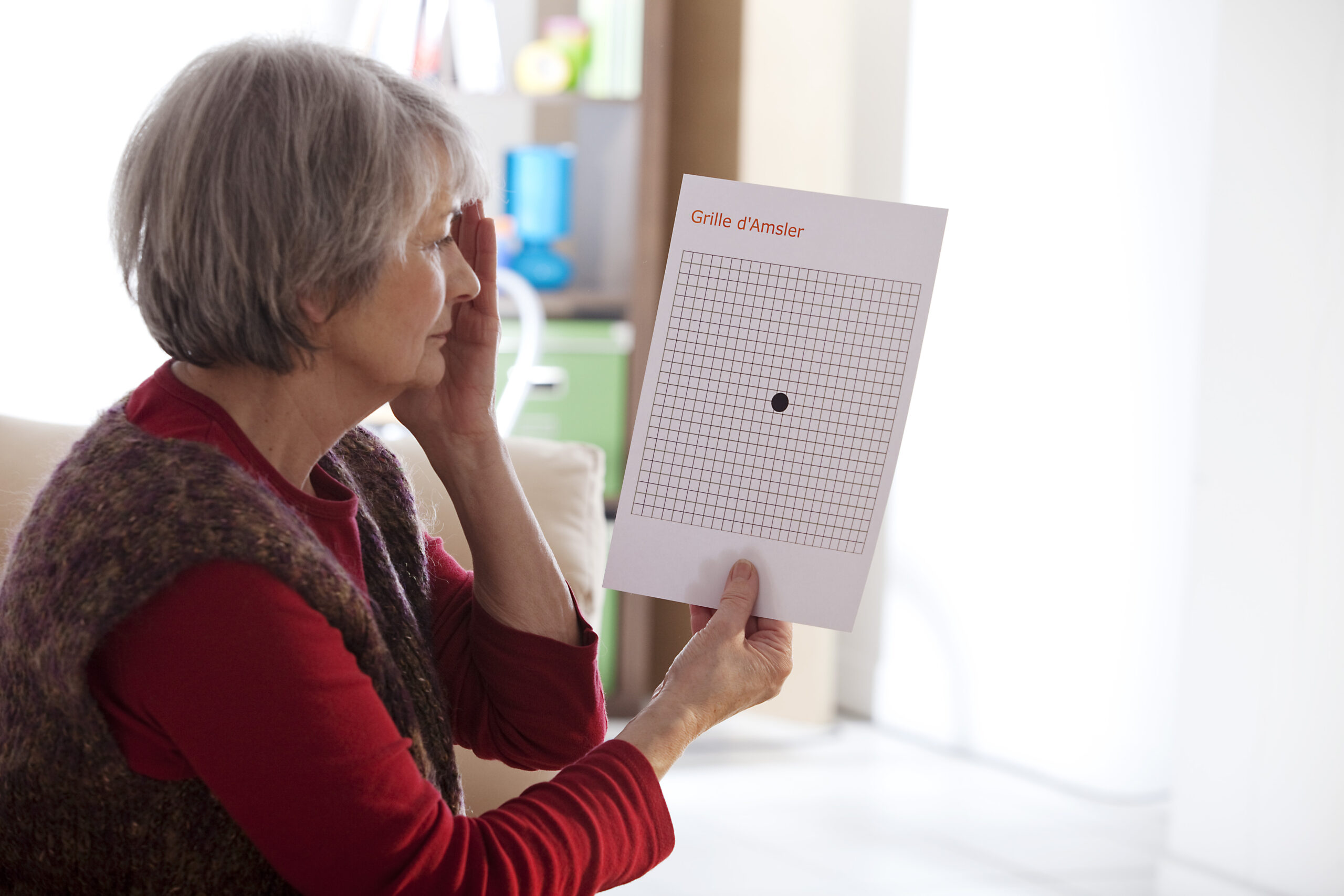 A woman getting an eye exam to determine if she suffers from any times of retinopathy