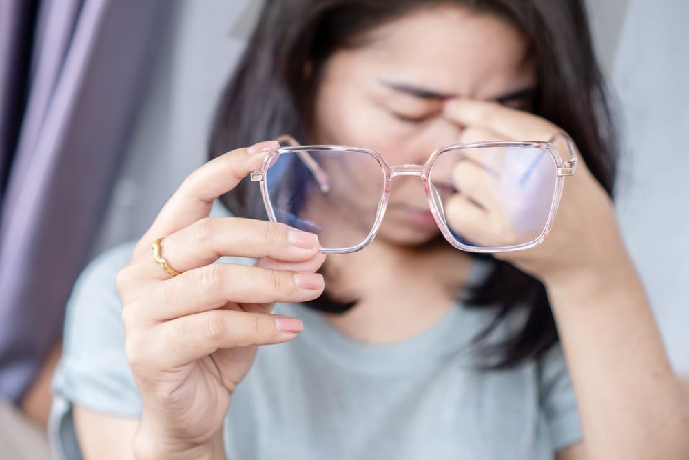 Woman suffering the effects of digital eye strain