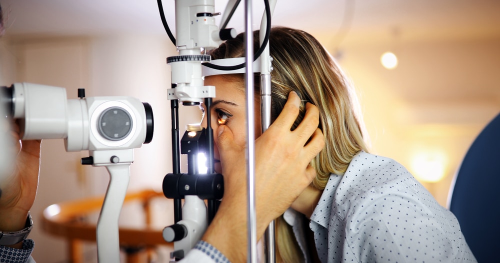 Woman getting an eye exam by our leading Optometrist Nashville