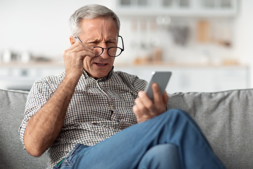 A man struggling with poor vision. Learn how to prevent cataracts and other vision-related diseases at a comprehensive eye exam with our Nashville Eye Doctor