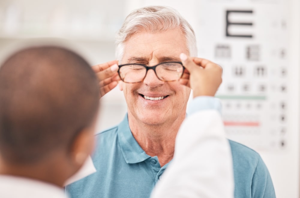 Man getting fit for eye glasses during his appointment with our VSP eye doctors in Nashville