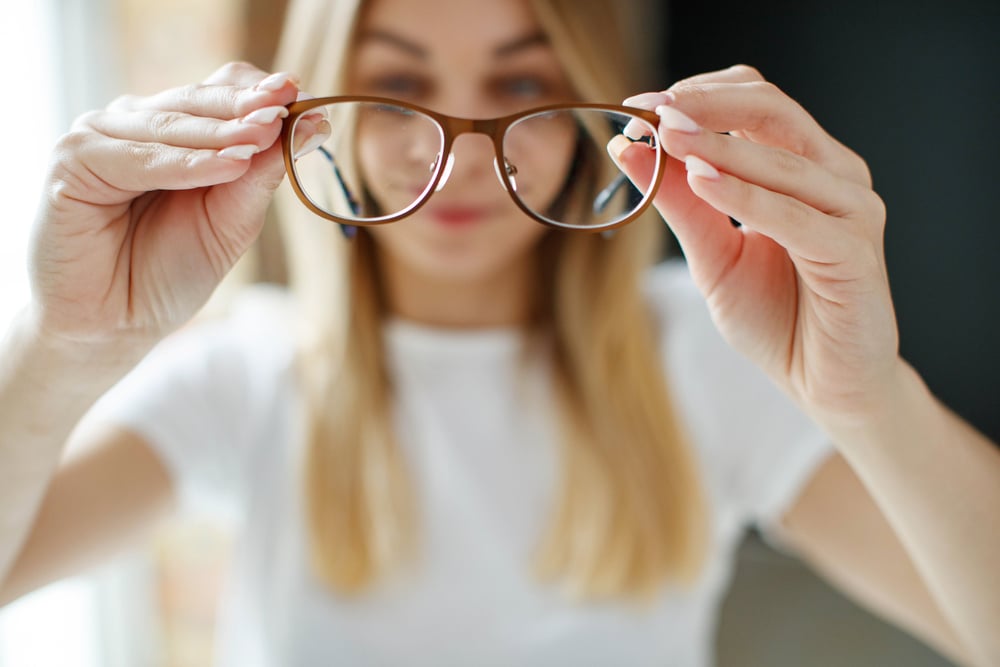Woman getting astigmatism glasses, the most common form of astigmatism treatment