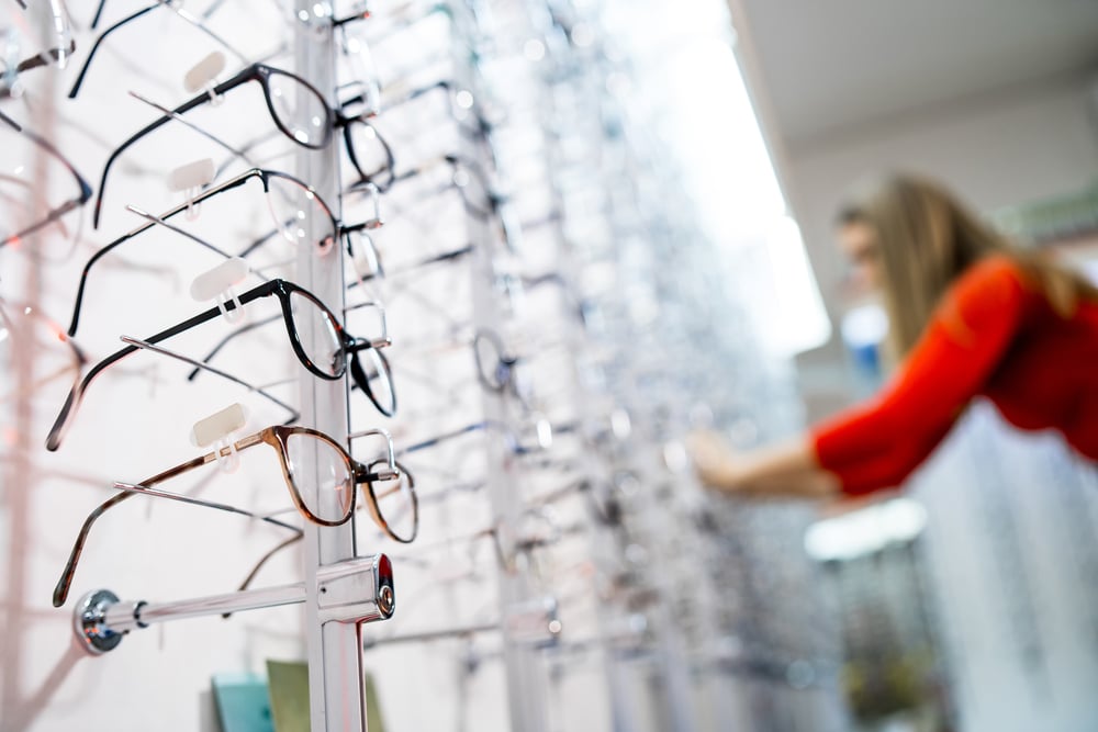 Woman shopping for prescription glasses at our Nashville Optometrist Boutique